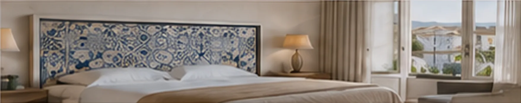 Hotel bedroom with a framed headboard panel of hand-painted blue Portuguese tiles